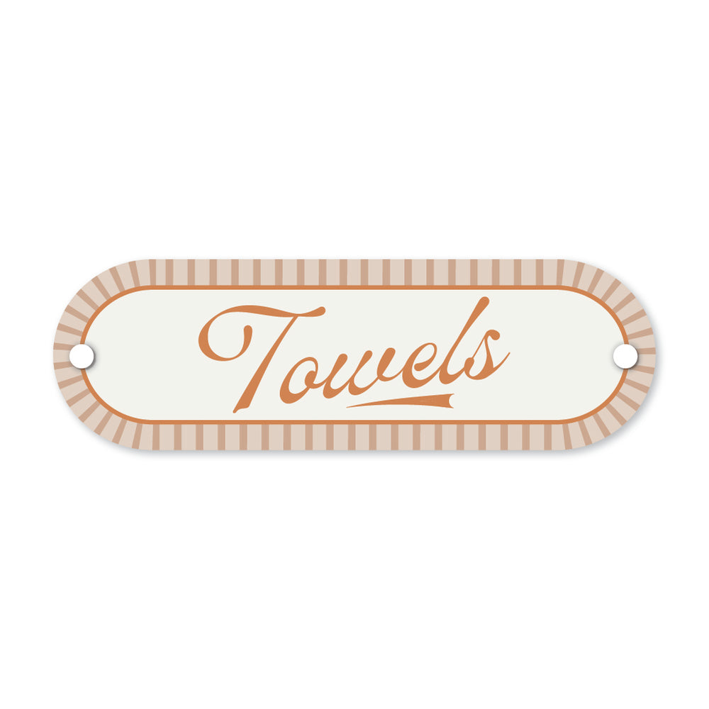Decorative sign with 'Towels' text on a white background