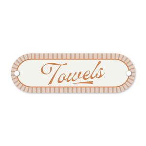 Decorative sign with 'Towels' text on a white background