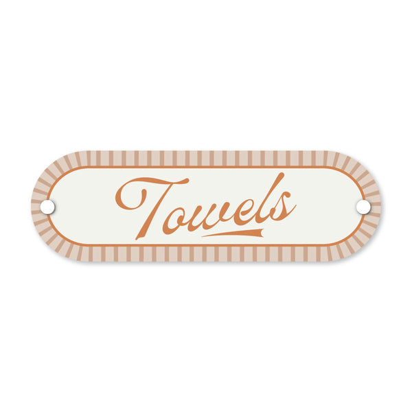 Decorative sign with 'Towels' text on a white background