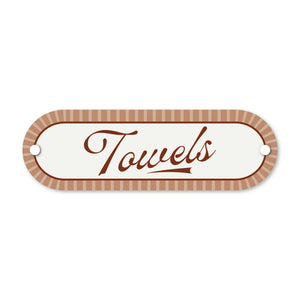 Decorative sign with 'Towels' text and striped border on a white background