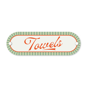 Decorative sign with 'Towels' text on a white background