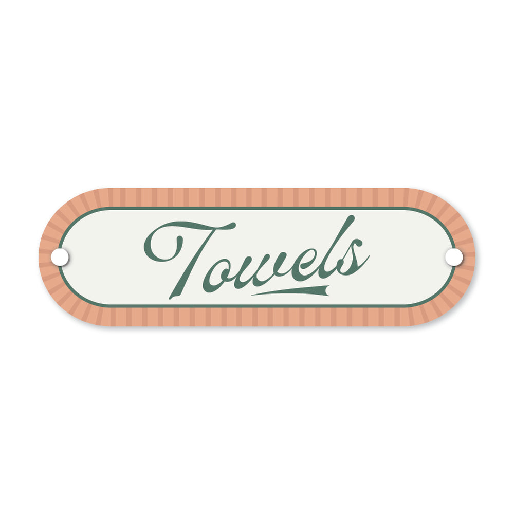 Decorative sign with 'Towels' text on a white background