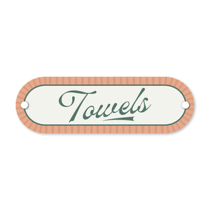 Decorative sign with 'Towels' text on a white background