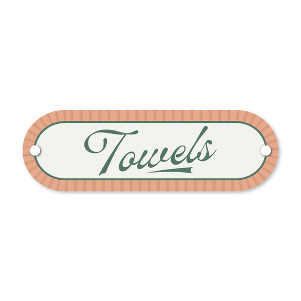 Decorative sign with 'Towels' text on a white background