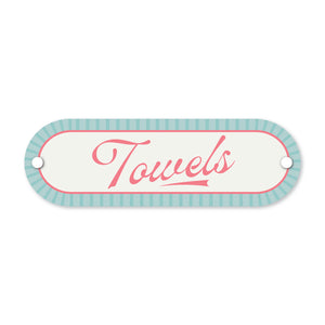 Decorative sign with 'Towels' text on a white background