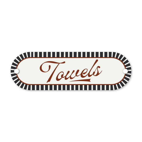 Decorative sign with 'Towels' text and black and white striped border on a white background